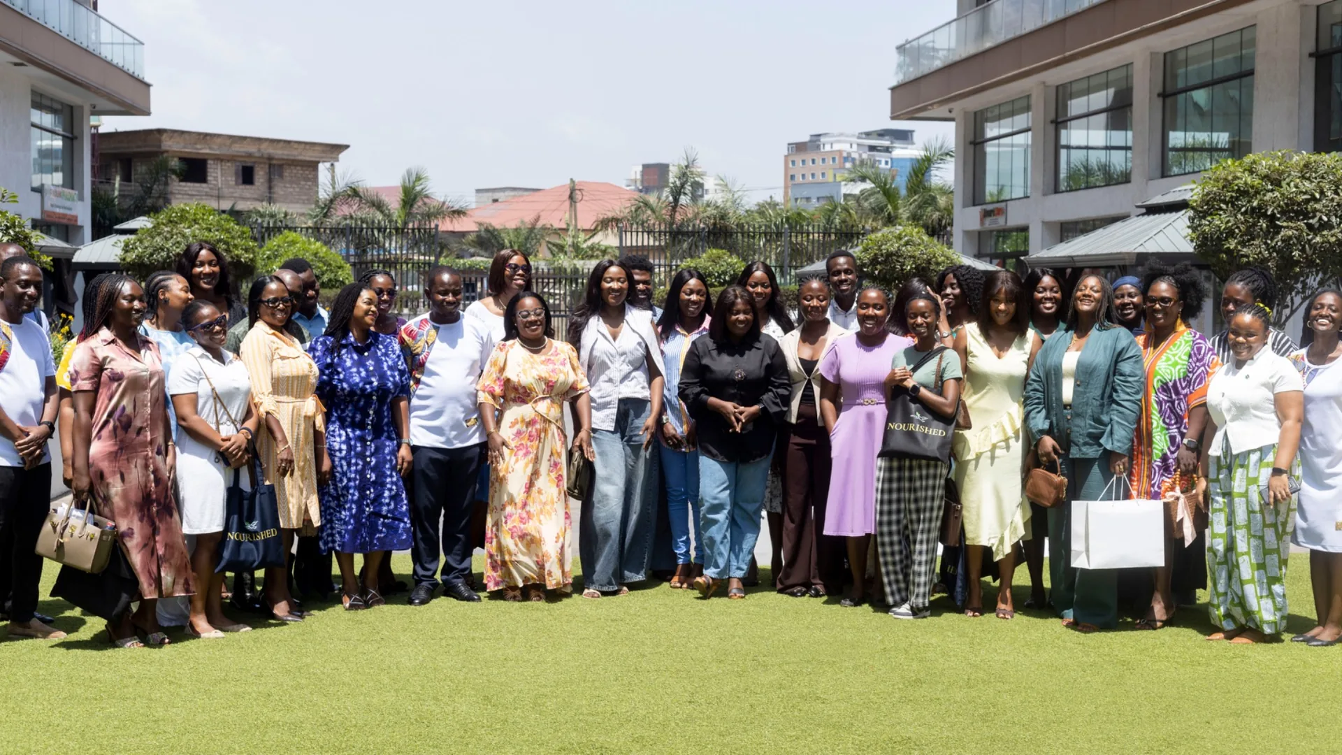 NOURISHED Edition 1 — attendees gathered on the lawn, World Mental Health Day 2026
